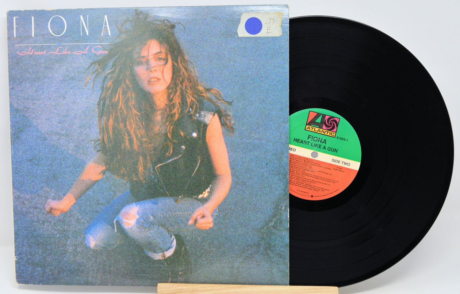 Vinyl record with cover featuring a person and colorful label
