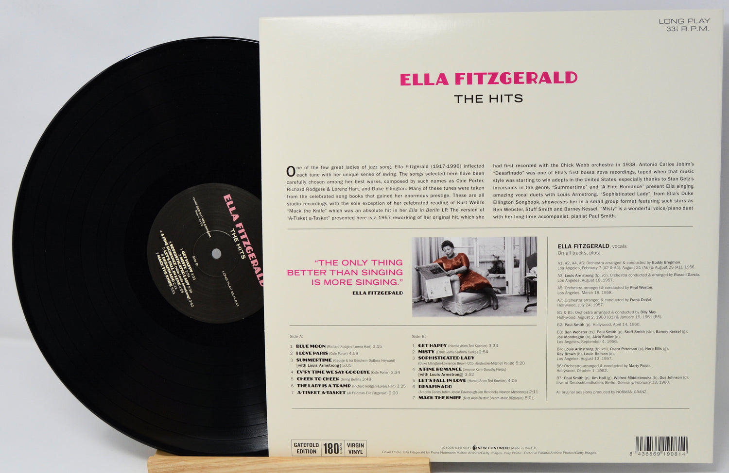 Vinyl record with cover displaying 'Ella Fitzgerald: The Hits' on a light gray background