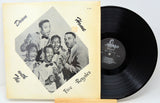 Vinyl record with cover featuring a group of men and album details.