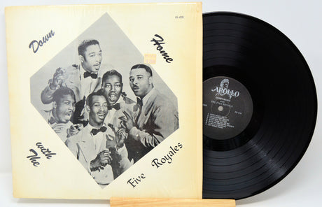Vinyl record with cover featuring a group of men and album details.