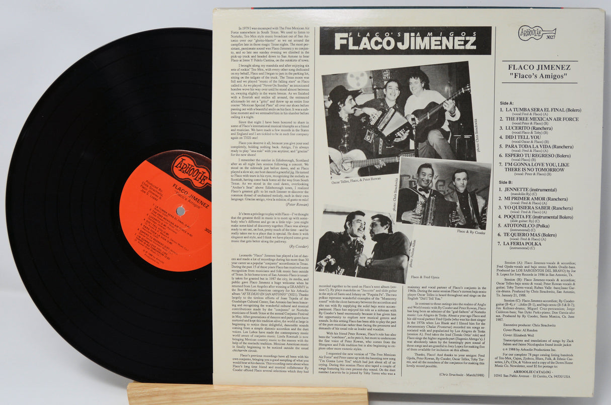 Vinyl record with a white sleeve featuring text and images of a musician.