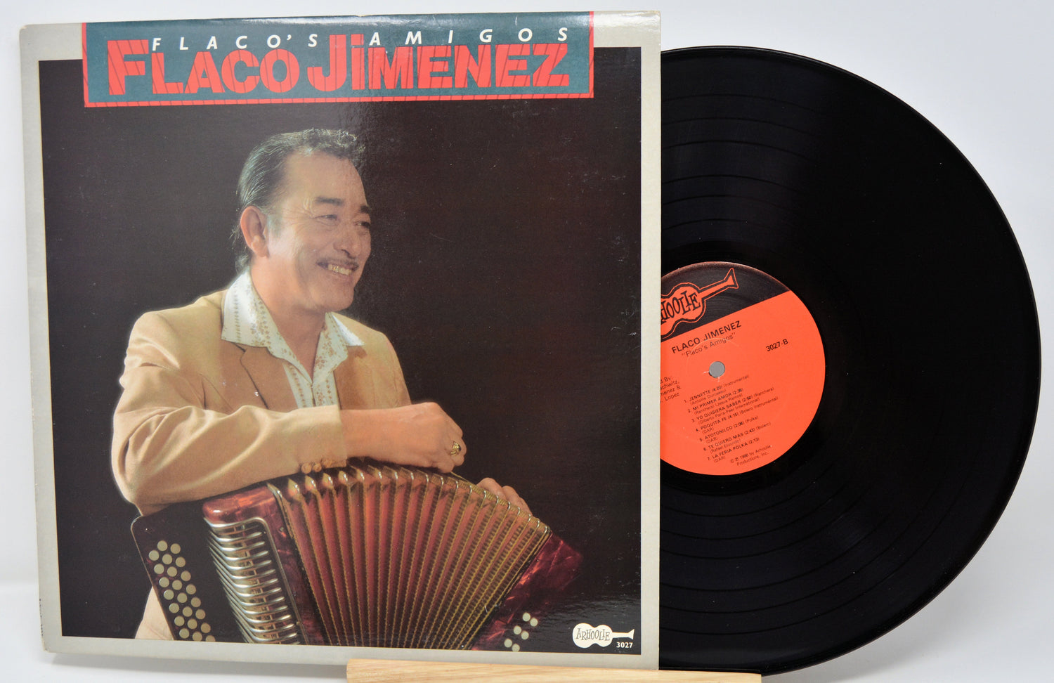 Vinyl record with cover featuring a man playing an accordion, titled 'Flaco Jimenez'.