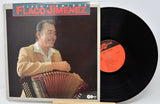Vinyl record with cover featuring a man playing an accordion, titled 'Flaco Jimenez'.