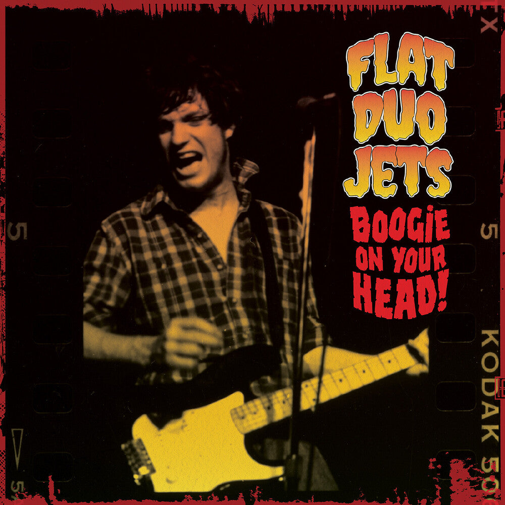 Album cover with a person playing guitar and text 'Flat Duo Jets Boogie on Your Head' against a dark background.