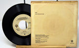 Vinyl record with label and back cover on a white background