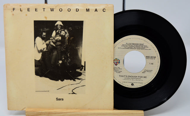Fleetwood Mac vinyl record with cover on a white background