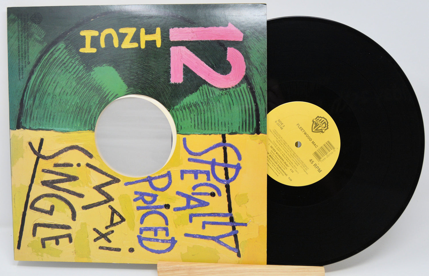 Back cover of Fleetwood Mac specialty priced maxi single 12 inch vinyl with record showing