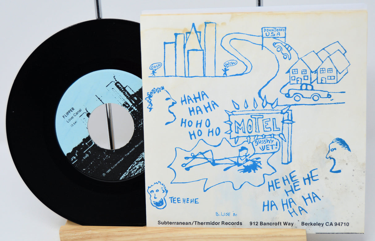Vinyl record with a hand-drawn cover featuring text and illustrations.