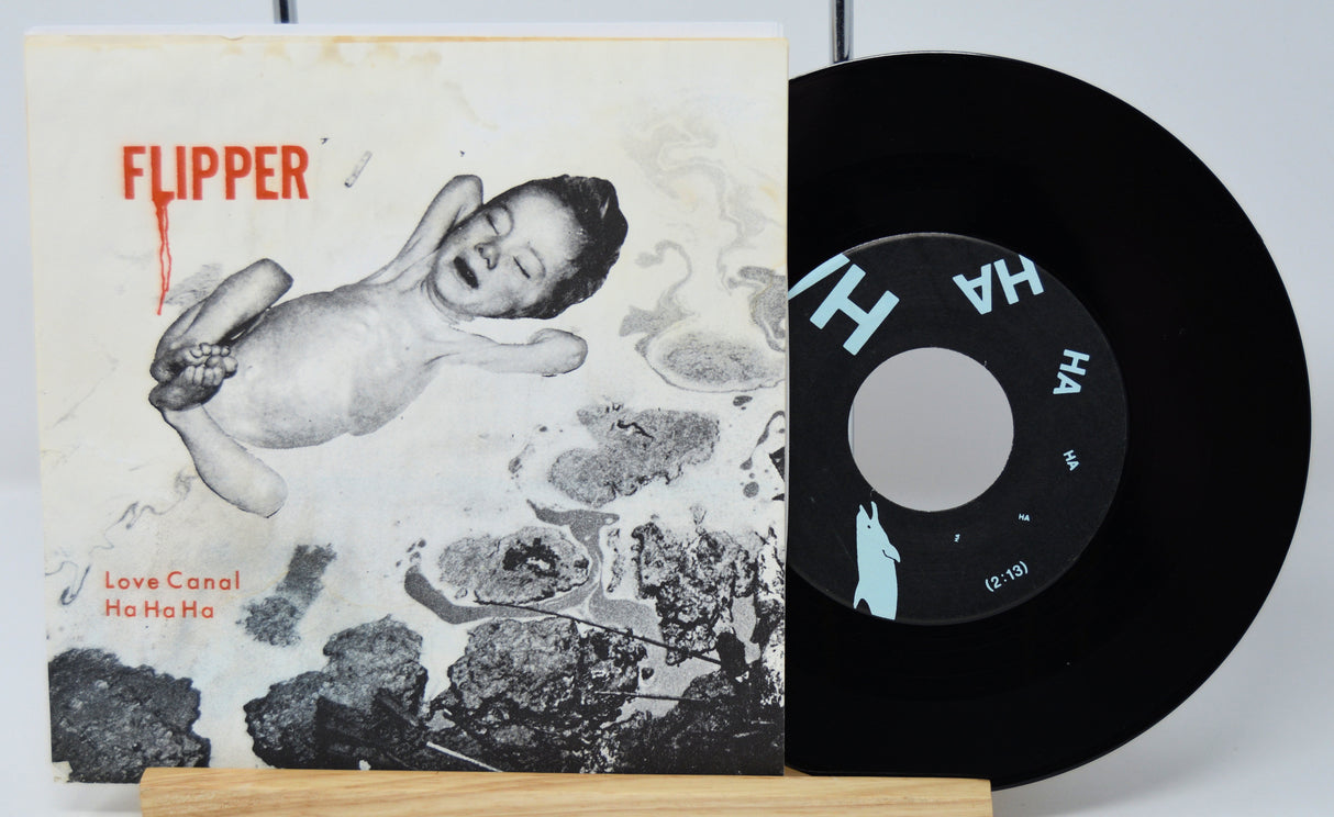 Vinyl record with cover featuring a black and white illustration and text 'Flipper' on a light gray background.