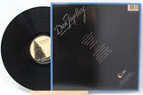 Greatest Hits by Dan Fogelberg with the vinyl record on the left and the rear album cover on the right.