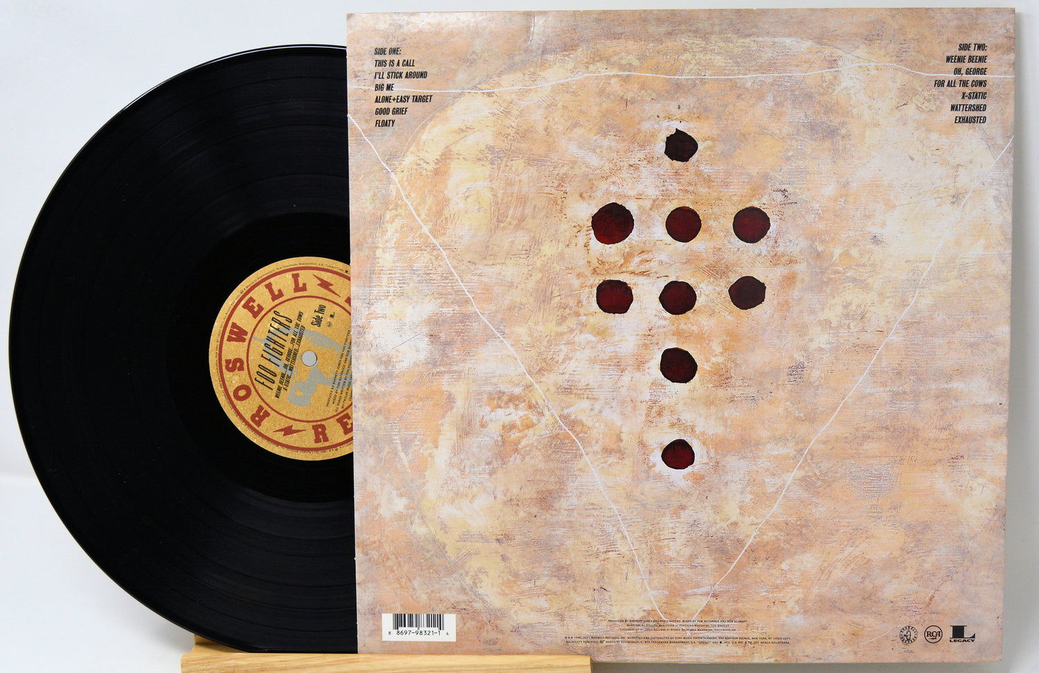 Vinyl cover featuring a brown metal gun