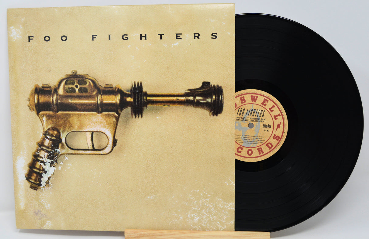 Vinyl cover featuring a brown metal gun