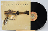 Vinyl cover featuring a brown metal gun