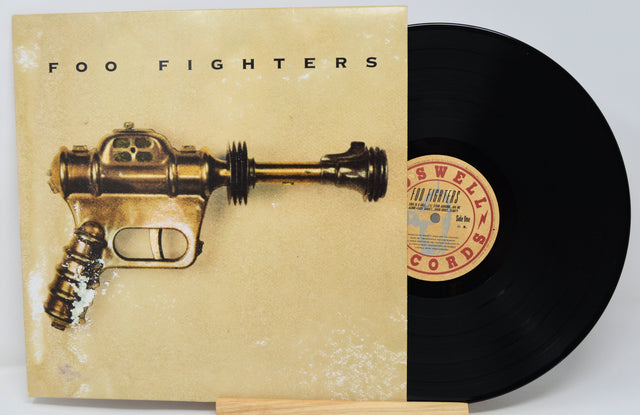 Vinyl cover featuring a brown metal gun