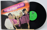 Vinyl record with cover featuring a band and 'The Fools Sold Out' text.