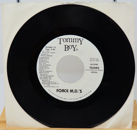 Vinyl record with 'Tommy Boy' label and 'Force M.D.'s' on a white background