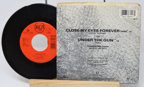 Vinyl record and its cover with text on a white background