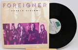 A used vinyl record of Foreigner's album 'Double Vision' with the band members pictured on the cover.