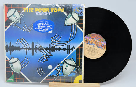 Vinyl record with cover featuring 'The Four Tops Tonight!' on a light gray background