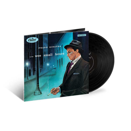 Vinyl record with cover featuring a man in a suit and hat, set against a city street backdrop.