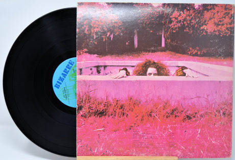 'Frank Zappa Hot Rats' Vinyl record with a colorful cover featuring a person coming up out of the ground.