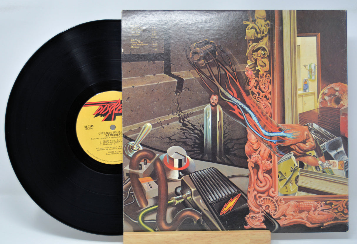 'Frank Zappa, Over-Nite Sensation' Vinyl record with a colorful cover featuring a person and mechanical elements.