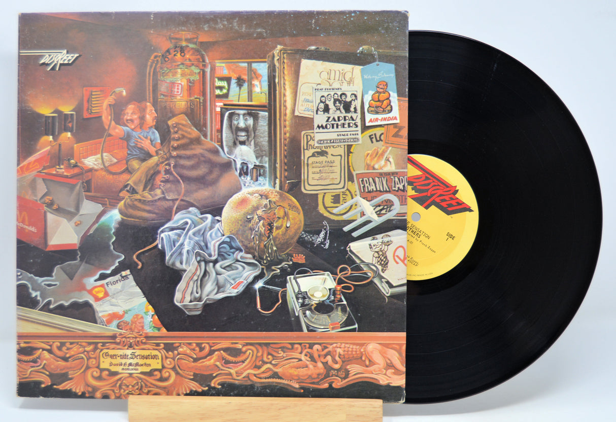 'Frank Zappa, Over-Nite Sensation' Vinyl record with a colorful cover featuring a scene of people in a diner.