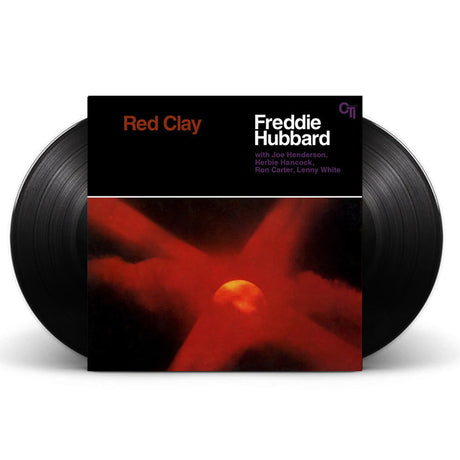 Freddie Hubbard's 'Red Clay' vinyl record album with two black records partially visible behind the square album cover on a white background.