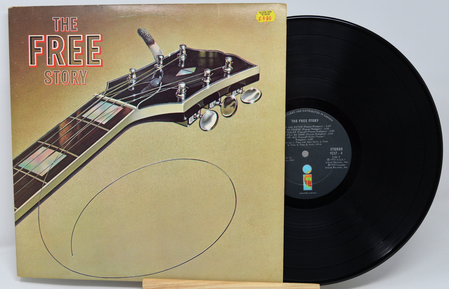 Vinyl record with a guitar headstock design on the cover