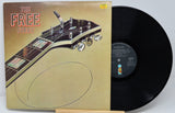 Vinyl record with a guitar headstock design on the cover
