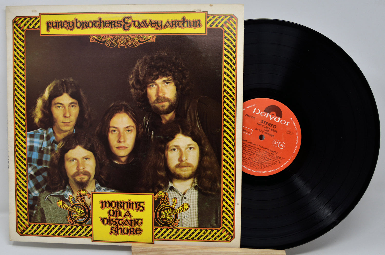 Vinyl record with cover featuring a band and album title 'Mornings on a Distant Shore' by The Byrds.
