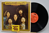 Vinyl record with cover featuring a band and album title 'Mornings on a Distant Shore' by The Byrds.
