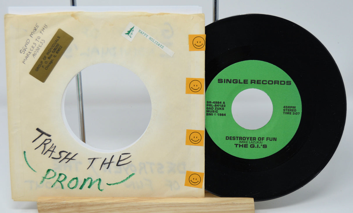 Vinyl record with a green label and a sleeve labeled 'Trash the Prom' on a white background