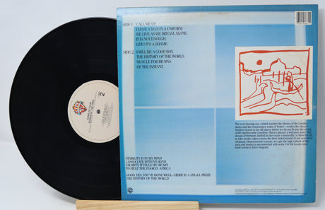 Vinyl record with blue cover featuring text and a red illustration on a white background