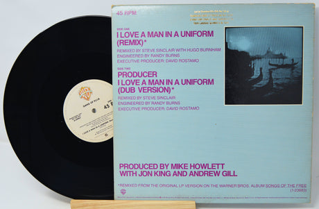Vinyl record with cover featuring text and a black and white image of people on a boat.