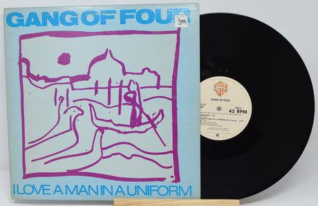 Vinyl record with cover featuring 'Gang of Four' album art and label.