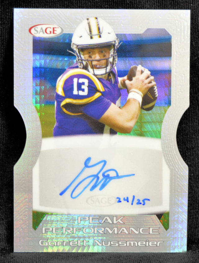 Football trading card with player holding a ball, autograph, and 'Peak Performance' text.