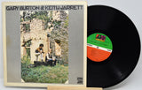 Gary Burton & Keith Jarrett vinyl record album with the cover sleeve on the left and the black LP record partially visible on the right. The record label shows a green and orange center label with the CBS/Sony logo.