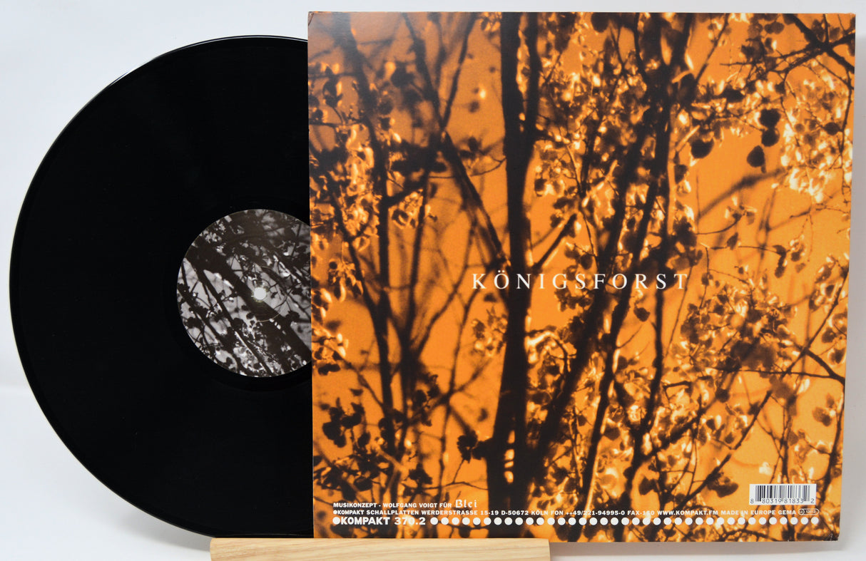 Vinyl record with colorful cover and label on a white background