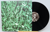 Vinyl record with a green cover featuring the word 'GAS' and a black record.