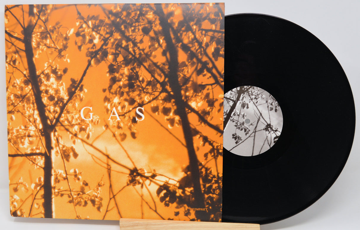 Vinyl record with orange cover featuring tree silhouettes and 'GAS' text.