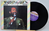 Vinyl record with cover featuring Marvin Gaye's 'Greatest Hits' on a white background