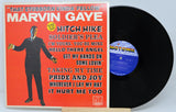 Vinyl record with Marvin Gaye album cover featuring a red background and black vinyl disc.