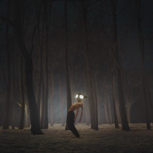 Person with glowing eyes walking through a dark forest
