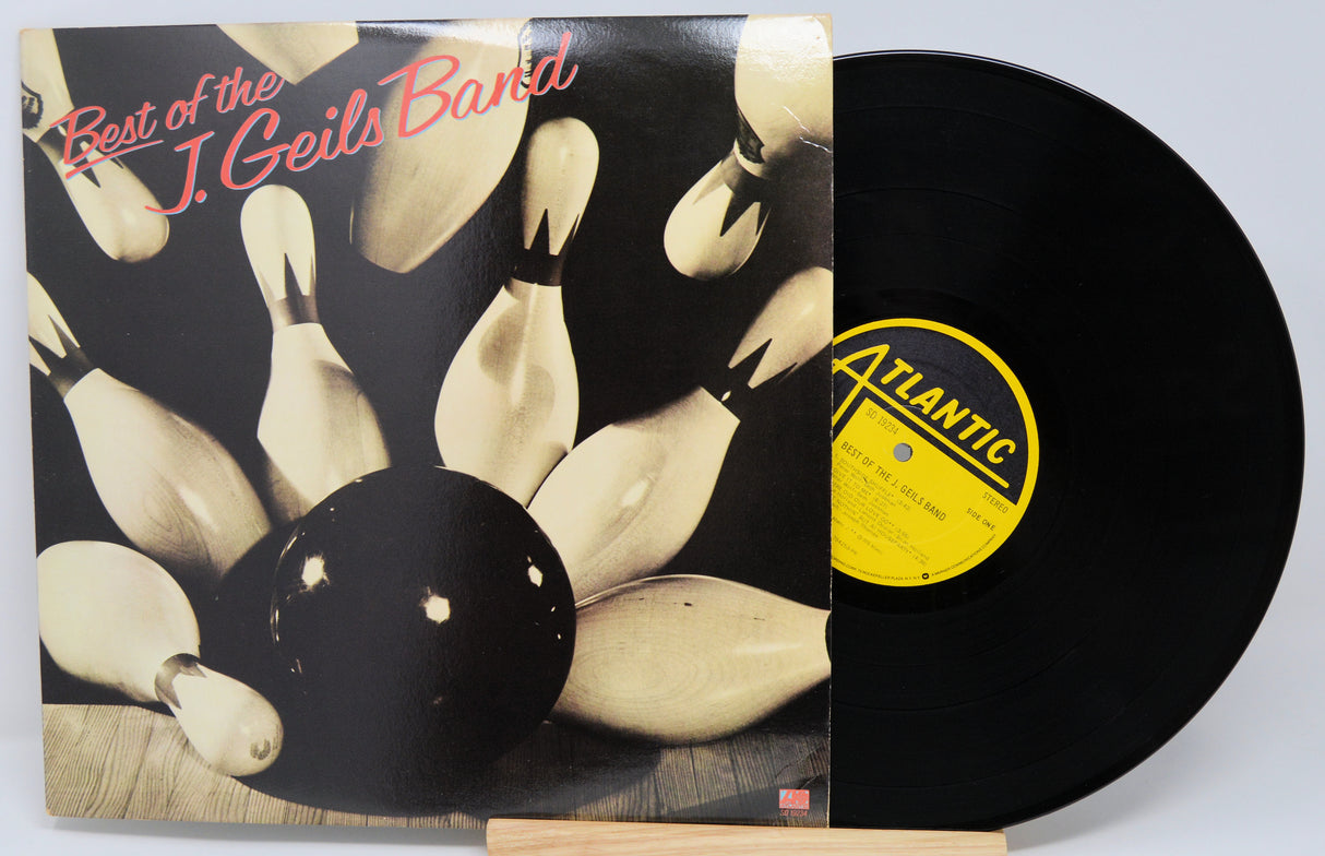 Vinyl record with cover featuring bowling pins and 'Best of the J. Geils Band' text, Atlantic label visible.