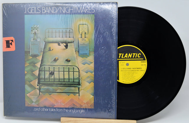 Vinyl record and cover with 'J. Geils Band Nightmares' on a white background