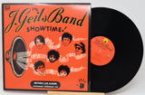 Vinyl record and cover of 'The J. Geils Band Showtime' album on a white background