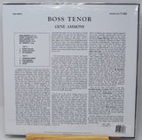 The back cover of a vinyl record sleeve for Gene Ammons's 'Boss Tenor' on Prestige 7180, photographed flat against a white background with a small wooden surface visible at the bottom.