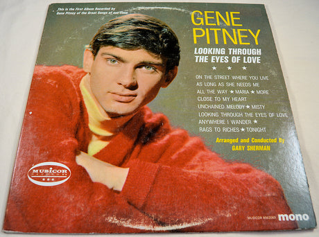 Front cover of Gene Pitney 'Looking Through The Eyes of Love' vinyl album showing Gene Pitney in a red sweater