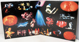 Album cover with concert images and colorful lighting effects on a black background